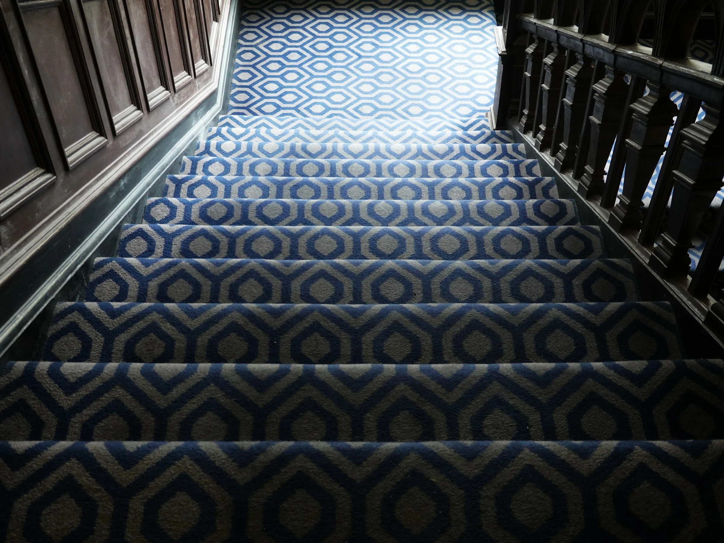 Staircase with a patterned carpet runner