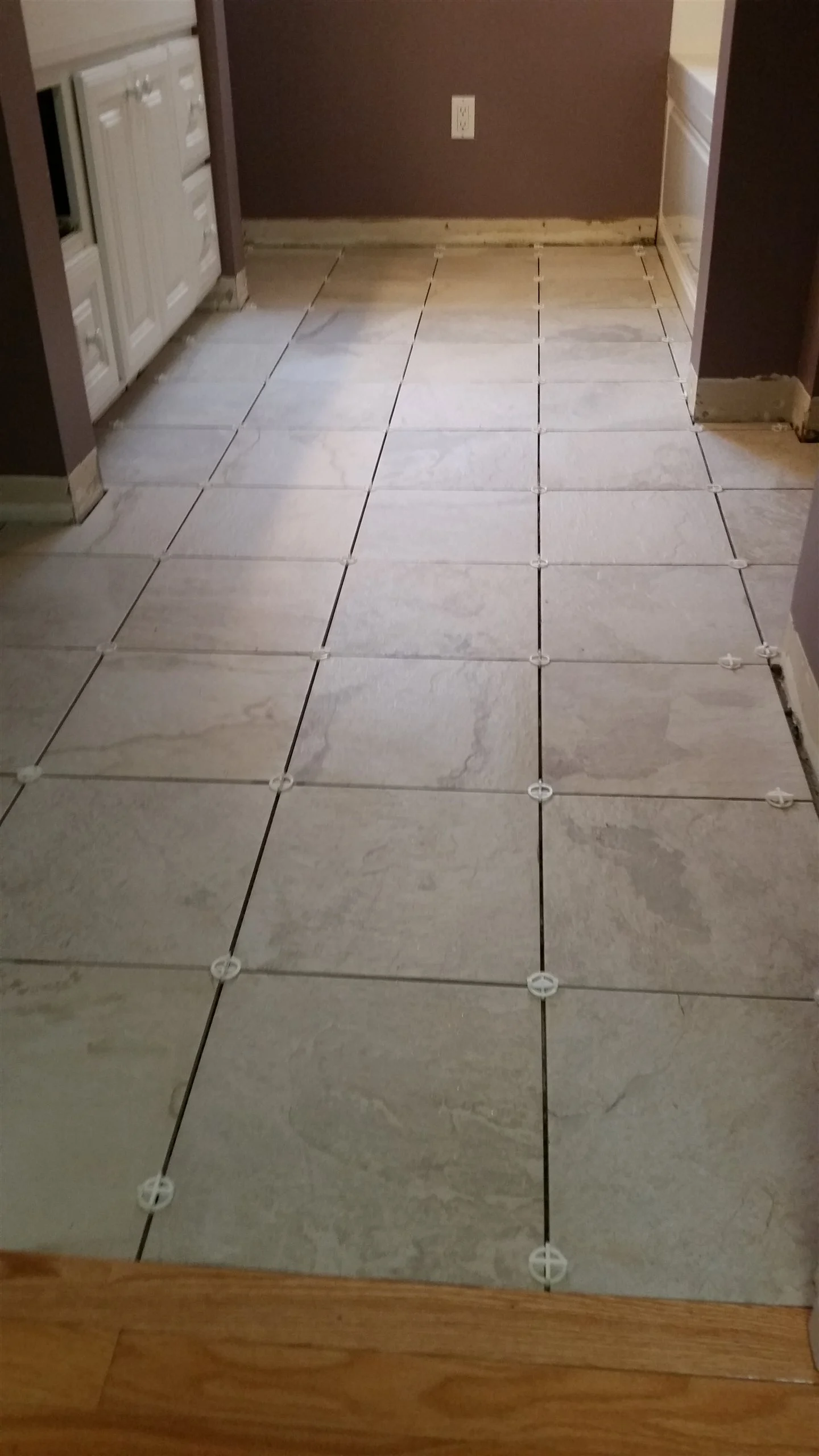 Tile floor and wall installation by All About Flooring, Derry NH