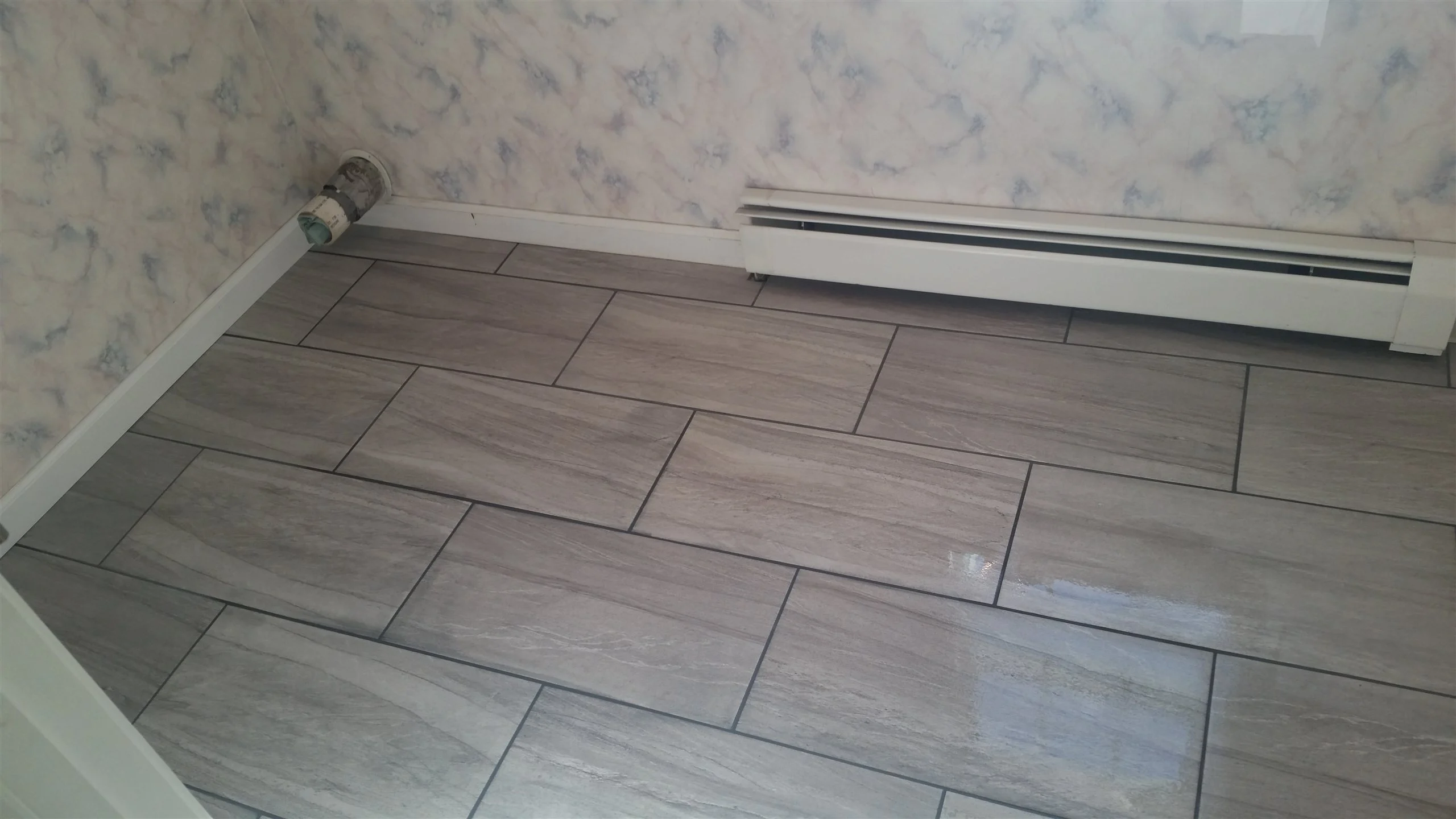 Tile floor and wall installation by All About Flooring, Derry NH