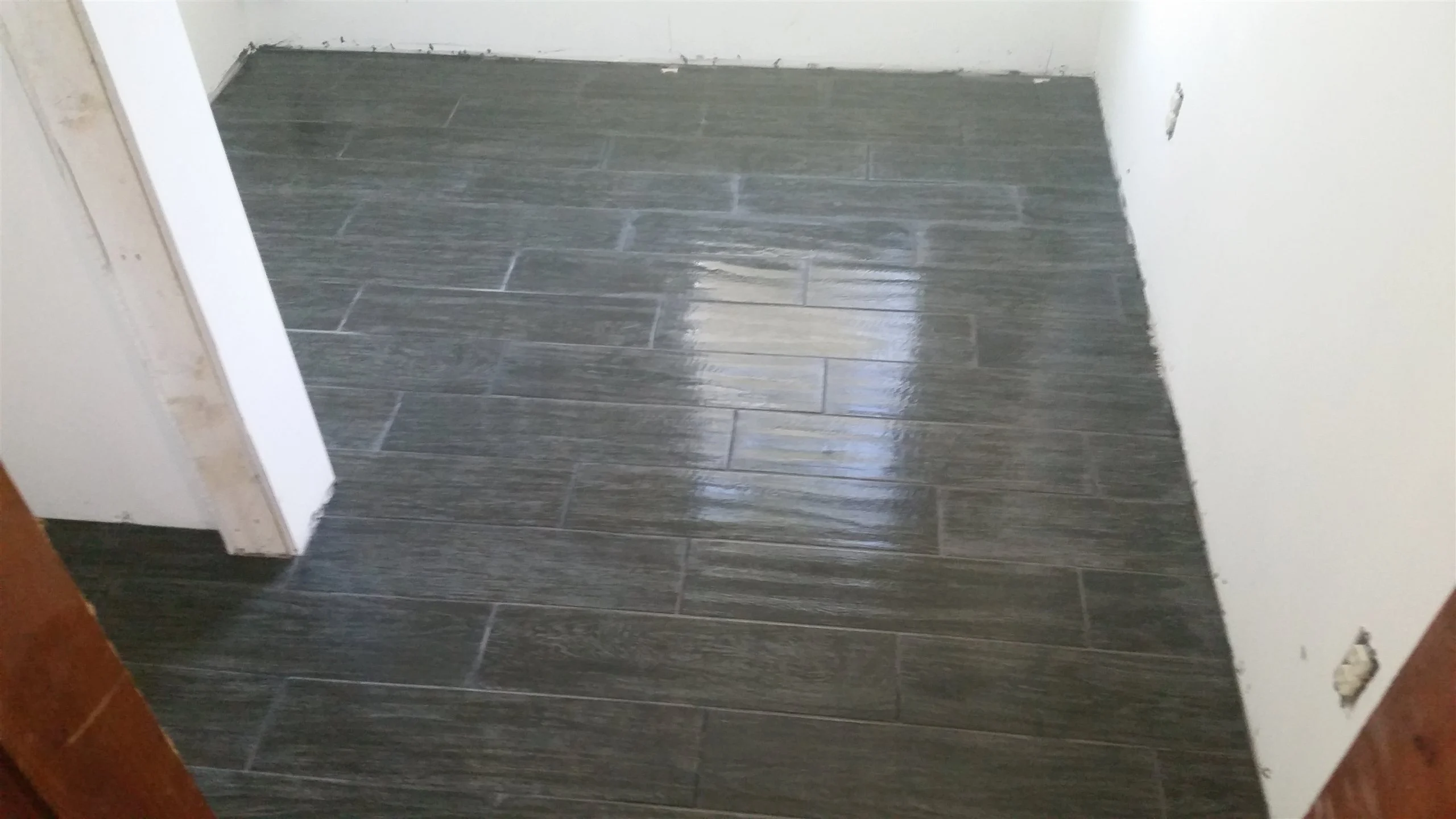 Tile floor and wall installation by All About Flooring, Derry NH
