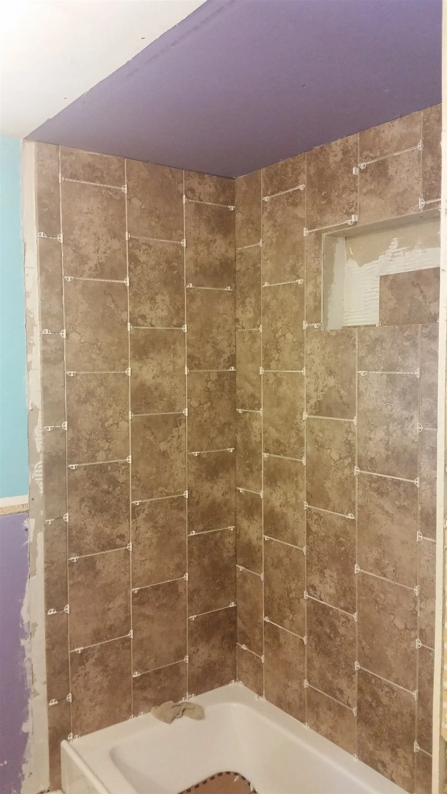Tile floor and wall installation by All About Flooring, Derry NH