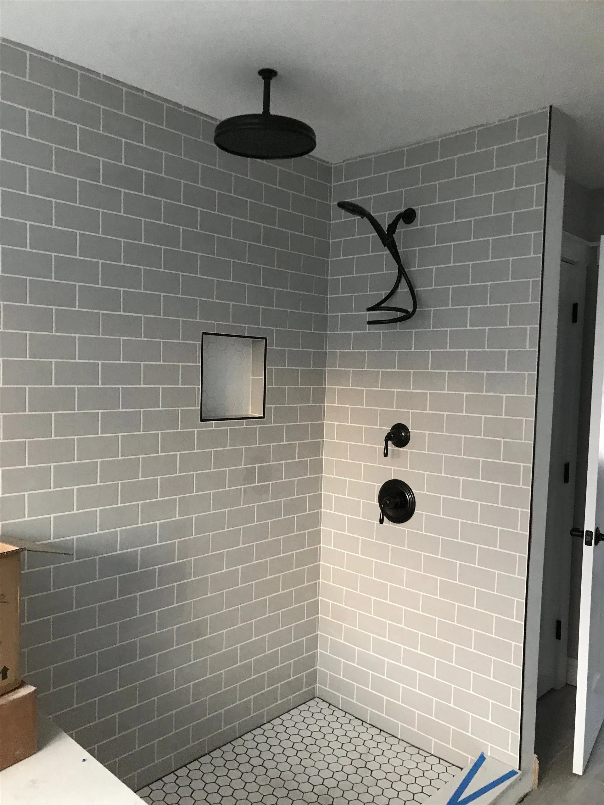 Subway tile shower walls with a niche